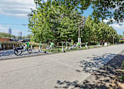 Thumbnail 27 of 28 - Atlanta, GA, Apartments Near The BeltLine - Virginia Highlands -  Tree-Lined Biking Trail with Shared Bikes and Pedal Scooters.