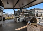 Thumbnail 44 of 94 - a view of the outdoor patio from the kitchen of a restaurant with a large window