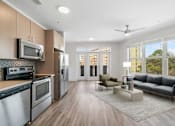Thumbnail 21 of 57 - A modern kitchen with wooden cabinets and stainless steel appliances.