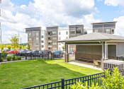 Thumbnail 25 of 25 - the preserve at ballantyne commons apartments patio and yard with grass