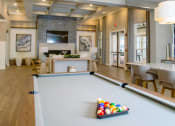 Thumbnail 41 of 60 - a pool table in the center of a living room