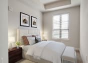 Thumbnail 12 of 58 - Buckhead, GA, Luxury Apartments Near Lenox Square Mall - 92 West Paces - Furnished Bedroom with White Walls, Carpet Flooring, Wooden Nightstands with Lamp, and Window with Blinds.