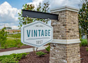 Thumbnail 31 of 31 - A sign that says Vintage 1857 is mounted on a brick pillar.