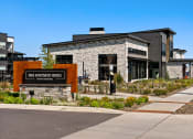 Thumbnail 2 of 94 - a building with a sign on the side of a sidewalk