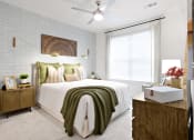 Thumbnail 29 of 49 - a bedroom with a white bedspread and green pillows