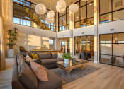 Thumbnail 2 of 40 - a living room with a couch and a coffee table