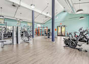 Thumbnail 11 of 36 - A gym with a variety of exercise equipment.