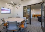 Thumbnail 8 of 40 - a view of a room with tables and chairs and a mirrored wall