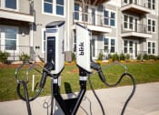 Thumbnail 35 of 40 - two charging stations in front of an apartment building