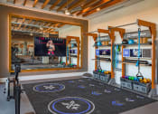 Thumbnail 15 of 40 - a workout room with weights and ropes and a scoreboard