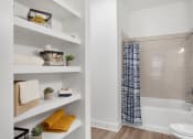 Thumbnail 15 of 46 - a bathroom with a shower and a toilet in a 555 waverly unit