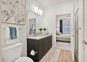 Thumbnail 30 of 49 - a bathroom with a toilet sink and mirror