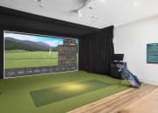 Thumbnail 36 of 49 - a golf simulator with a large screen on the wall