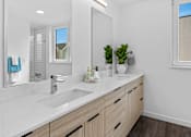 Thumbnail 15 of 45 - A bathroom with a white countertop and a large mirror.