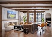 Thumbnail 4 of 16 - A modern living room with a large TV screen and comfortable seating.