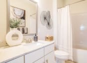 Thumbnail 16 of 60 - a bathroom with a sink toilet and a shower