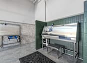 Thumbnail 31 of 34 - Dog-Friendly Luxury Apartments in Huntsville, AL - The Arcadia - Pet Spa with Washing Station, Step Stool, and Grooming Table.