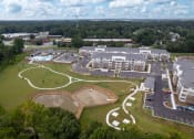 Thumbnail 42 of 46 - an aerial view of a building and a baseball field