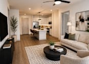 Thumbnail 30 of 40 - A modern living room with a black coffee table and a beige sofa.