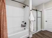 Thumbnail 83 of 94 - the preserve at ballantyne commons apartment bathroom with tub and shower
