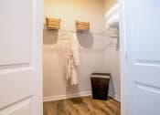 Thumbnail 17 of 60 - the preserve at ballantyne commons apartment closet with white walls and towels