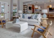 Thumbnail 22 of 60 - a living room with a couch and a table