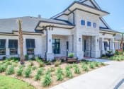 Thumbnail 21 of 60 - the front of a house with a sidewalk and landscaping