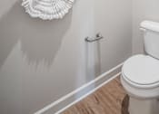 Thumbnail 45 of 65 - Three white plates are mounted on a wall above a toilet.