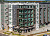 Thumbnail 1 of 34 - A modern building with the word "ARCADIA" on the front.
