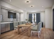 Thumbnail 10 of 49 - A modern dining room with a wooden table and chairs.
