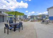 Thumbnail 21 of 28 - our apartments have a patio with tables and chairs and umbrellas
