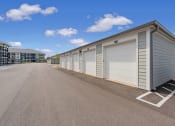 Thumbnail 20 of 28 - a row of garage doors on the side of a building