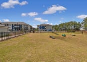 Thumbnail 24 of 28 - the preserve at ballantyne commons dog park with apartments in the background