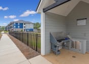 Thumbnail 23 of 28 - the preserve at ballantyne commons apartments patio and grill area with apartment buildings