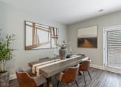 Thumbnail 29 of 71 - a dining room with a long table and chairs