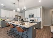 Thumbnail 23 of 71 - a kitchen with a counter top and a sink