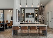 Thumbnail 4 of 71 - a kitchen with a counter top and chairs