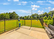 Thumbnail 39 of 71 - a view of a park with a fence and a bench