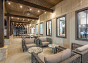 Thumbnail 60 of 71 - a lobby with chairs and tables and windows