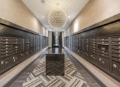 Thumbnail 35 of 47 - a long hallway filled with wine lockers and a large chandelier