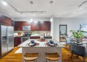 Thumbnail 3 of 38 - a kitchen with stainless steel appliances and a marble counter top
