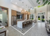 Thumbnail 15 of 38 - a large kitchen with a large island and a dining room table