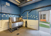 Thumbnail 33 of 38 - a room with a stainless steel sink and a door
