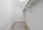 Thumbnail 20 of 35 - an empty room with white walls and a carpeted floor and a white ceiling fan