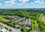 Thumbnail 29 of 29 - an aerial view of apartment buildings next to a body of water