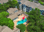 Thumbnail 27 of 31 - an aerial view of a house with a swimming pool