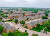 Thumbnail 64 of 69 - an aerial view of a neighborhood of brick houses