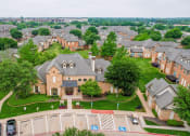 Thumbnail 68 of 69 - an aerial view of a neighborhood with houses and cars