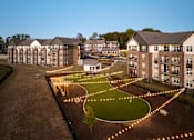 Thumbnail 6 of 45 - Apartment complex with a circular garden in the middle.