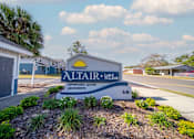 Thumbnail 6 of 15 - A sign for Altair at Lake Tolomato advertises affordable luxury apartments.